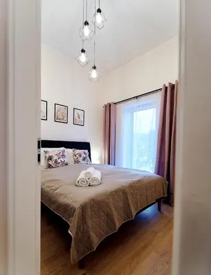 Łóżko lub łóżka w pokoju w obiekcie LAGUNA Apartament Polanica Residence 54