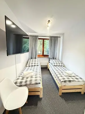 Łóżko lub łóżka w pokoju w obiekcie Apartamenty Przy Stoku Lądek Zdrój