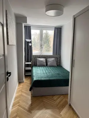 Łóżko lub łóżka w pokoju w obiekcie Apartament Wspomnienie