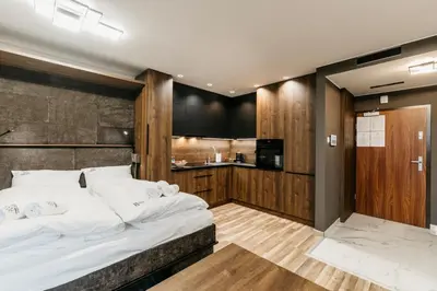 Łóżko lub łóżka w pokoju w obiekcie APARTAMENTY PARK CITY