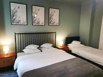 Łóżko lub łóżka w pokoju w obiekcie Apartament Retro