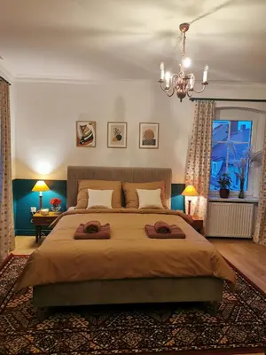 Łóżko lub łóżka w pokoju w obiekcie Apartament Retro