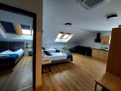 Łóżko lub łóżka w pokoju w obiekcie Pensjonat i Restauracja Hubertówka
