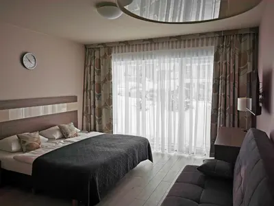 Łóżko lub łóżka w pokoju w obiekcie Apartament Czarna Góra TIGNES 4 Sienna
