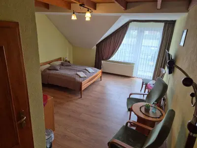 Łóżko lub łóżka w pokoju w obiekcie Restauracja Joanna