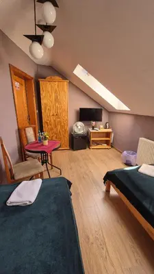Łóżko lub łóżka w pokoju w obiekcie Restauracja Joanna