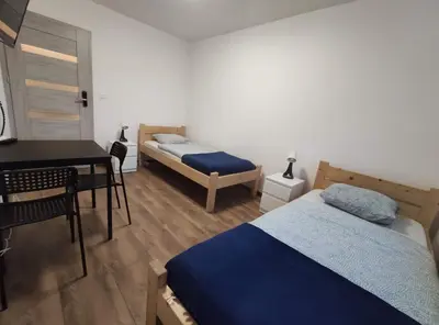Łóżko lub łóżka w pokoju w obiekcie Night Point