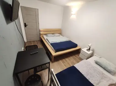 Łóżko lub łóżka w pokoju w obiekcie Night Point
