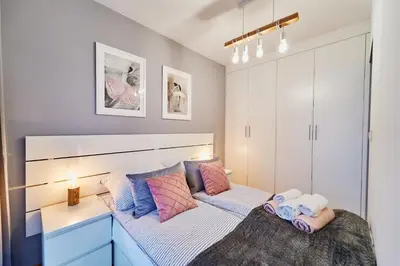 Łóżko lub łóżka w pokoju w obiekcie LAGUNA Apartament Polanica Residence 21