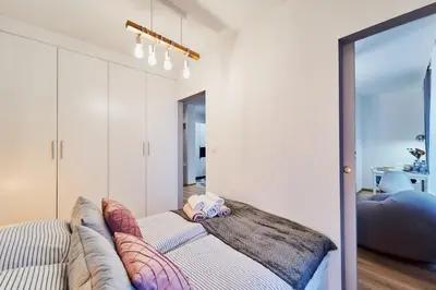 Łóżko lub łóżka w pokoju w obiekcie LAGUNA Apartament Polanica Residence 21