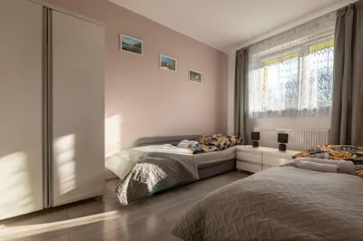 Łóżko lub łóżka w pokoju w obiekcie Apartament Milena