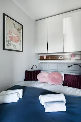 Łóżko lub łóżka w pokoju w obiekcie Apartament 4 pory roku