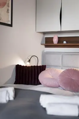 Łóżko lub łóżka w pokoju w obiekcie Apartament 4 pory roku
