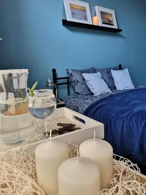 Łóżko lub łóżka w pokoju w obiekcie Apartament Mariacka
