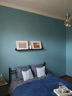 Łóżko lub łóżka w pokoju w obiekcie Apartament Mariacka