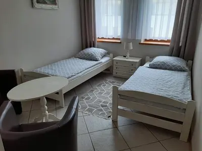 Łóżko lub łóżka w pokoju w obiekcie Pension Etiuda