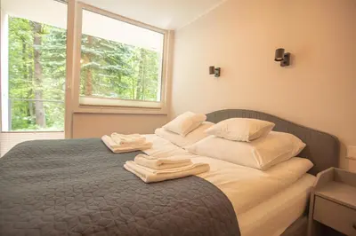 Łóżko lub łóżka w pokoju w obiekcie Apartament Jelonek Zdrój