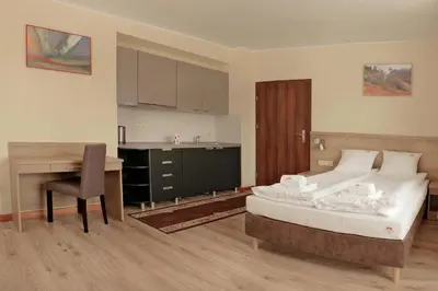 Łóżko lub łóżka w pokoju w obiekcie Bursztynowe Buki