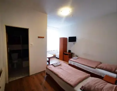 Łóżko lub łóżka w pokoju w obiekcie Hotel Stary Ratusz