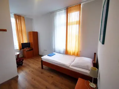 Łóżko lub łóżka w pokoju w obiekcie Hotel Stary Ratusz