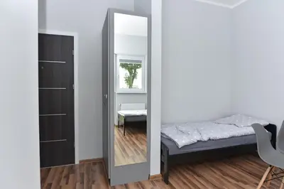 Łóżko lub łóżka w pokoju w obiekcie Zielona Dolina 2020