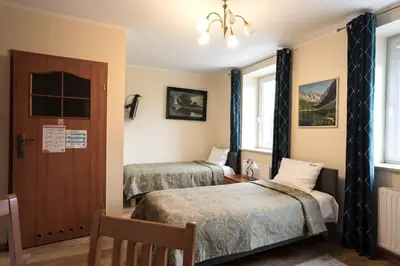 Łóżko lub łóżka w pokoju w obiekcie HOTEL I RESTAURACJA BROCHÓW