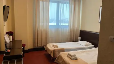 Łóżko lub łóżka w pokoju w obiekcie Neptun