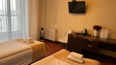 Łóżko lub łóżka w pokoju w obiekcie Neptun