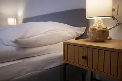 Łóżko lub łóżka w pokoju w obiekcie Wygodne Apartamenty Okrąglak Stronie Śląskie- Czarna Góra