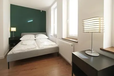 Łóżko lub łóżka w pokoju w obiekcie Wygodne Apartamenty Okrąglak Stronie Śląskie- Czarna Góra