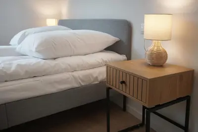 Łóżko lub łóżka w pokoju w obiekcie Wygodne Apartamenty Okrąglak Stronie Śląskie- Czarna Góra
