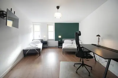 Łóżko lub łóżka w pokoju w obiekcie Wygodne Apartamenty Okrąglak Stronie Śląskie- Czarna Góra