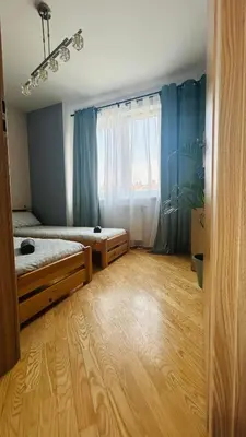 Łóżko lub łóżka w pokoju w obiekcie Apartament Słoneczny 6