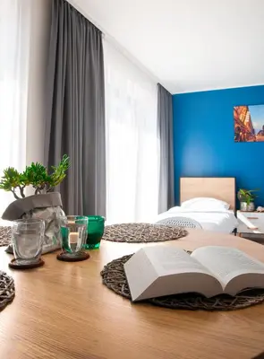 Łóżko lub łóżka w pokoju w obiekcie Tanie Noclegi Gliwice - Apartamenty Łowicka 28