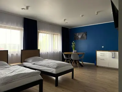 Łóżko lub łóżka w pokoju w obiekcie Tanie Noclegi Gliwice - Apartamenty Łowicka 28