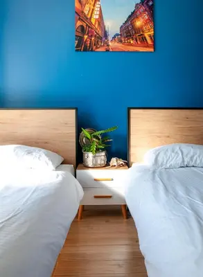 Łóżko lub łóżka w pokoju w obiekcie Tanie Noclegi Gliwice - Apartamenty Łowicka 28