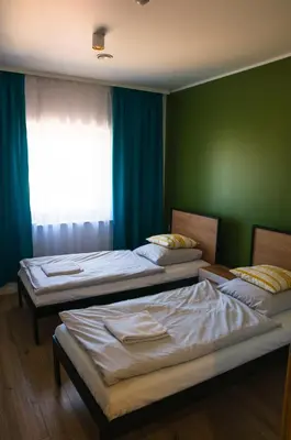 Łóżko lub łóżka w pokoju w obiekcie Tanie Noclegi Gliwice - Apartamenty Łowicka 28