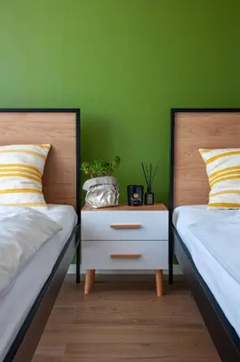 Łóżko lub łóżka w pokoju w obiekcie Tanie Noclegi Gliwice - Apartamenty Łowicka 28