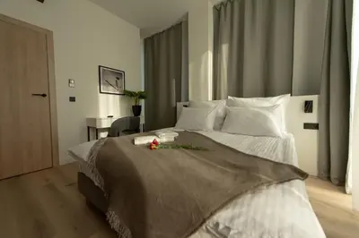 Łóżko lub łóżka w pokoju w obiekcie Sarnia Point Apartamenty Prestige