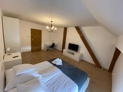Łóżko lub łóżka w pokoju w obiekcie Stadnina Koni w Kłaczynie