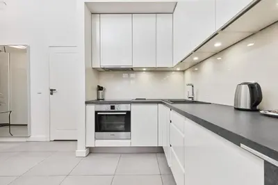 Kuchnia lub aneks kuchenny w obiekcie City Center Railway Station Apartment Piłsudskiego by Noclegi Renters