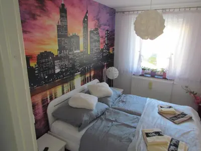Łóżko lub łóżka w pokoju w obiekcie Apartament Ella
