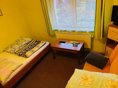 Łóżko lub łóżka w pokoju w obiekcie Pokoje gościnne Harnaś