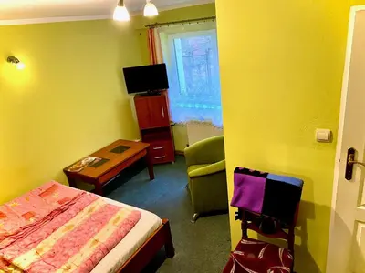 Łóżko lub łóżka w pokoju w obiekcie Pokoje gościnne Harnaś