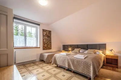 Łóżko lub łóżka w pokoju w obiekcie Willa Pamiętnik