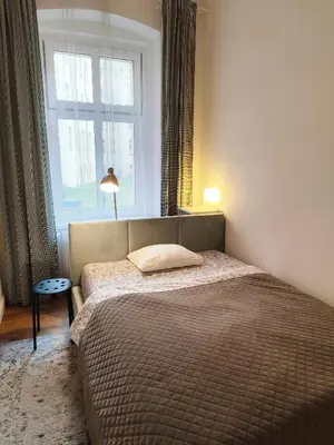 Łóżko lub łóżka w pokoju w obiekcie Apartament ROZETA centrum 6os
