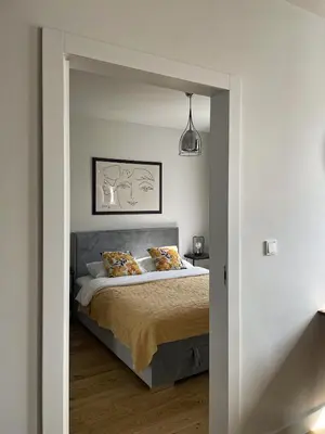 Łóżko lub łóżka w pokoju w obiekcie visiting apartments - Wyspa Słodowa