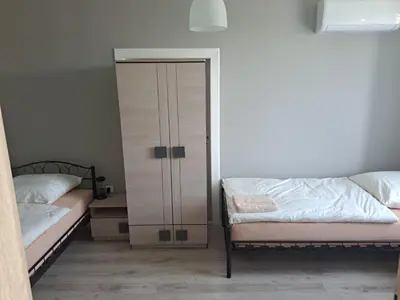 Łóżko lub łóżka w pokoju w obiekcie Mieszkania turystyczno - pracownicze