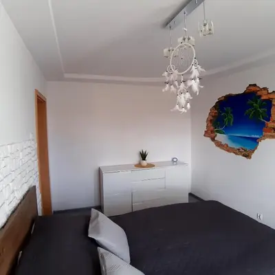 Łóżko lub łóżka w pokoju w obiekcie Apartament Hetmańska
