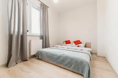 Łóżko lub łóżka w pokoju w obiekcie Nocosfera Apartament Wrocławski